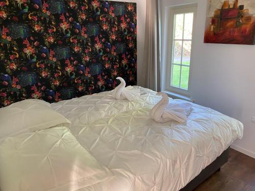 Postel nebo postele na pokoji v ubytování Aaltje’s Hoeve