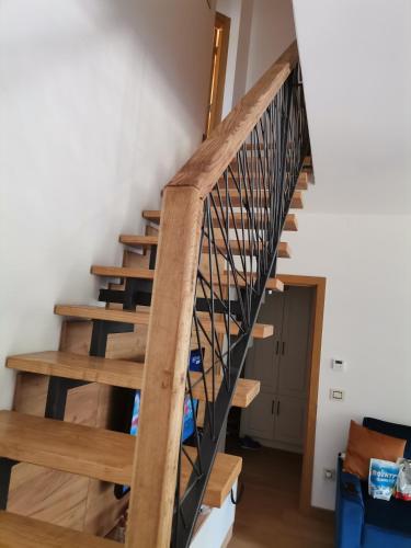 a staircase in a house with wooden steps at V&Dj in Čajetina