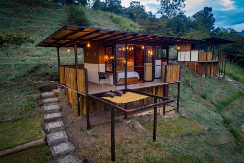 una representación de una casa en una colina en Natubri Ecohotel, en San Francisco