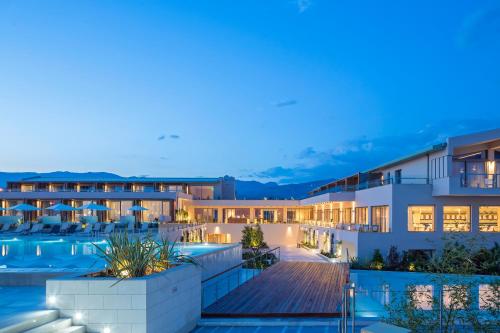 a view of the exterior of a hotel at night at Horizon Blu Boutique Hotel in Kalamata
