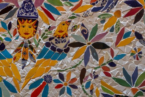 a mosaic of flowers and birds on a wall at Casa Maricela B&B in San Miguel de Allende