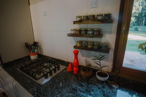 Virtuvė arba virtuvėlė apgyvendinimo įstaigoje Kambá House