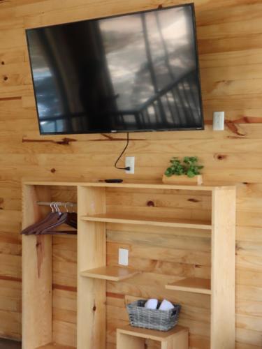 a tv on top of a wooden wall at SpazioVèneto in Mazamitla