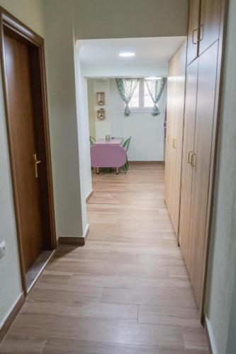 an empty hallway with a table in a room at Apartment in Asprovalta in Asprovalta