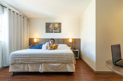 Hotel Dom Rafael Premium tesisinde bir odada yatak veya yataklar