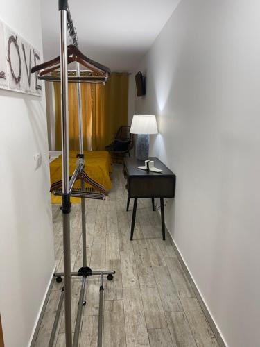 a room with a desk and a bed and a table at Esmeralda Holidays Apartments in Funchal