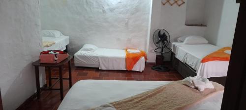 Postel nebo postele na pokoji v ubytování Hotel Central Graciela