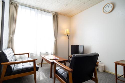 Televisyen dan/atau pusat hiburan di Enoshima Apartment Hotel
