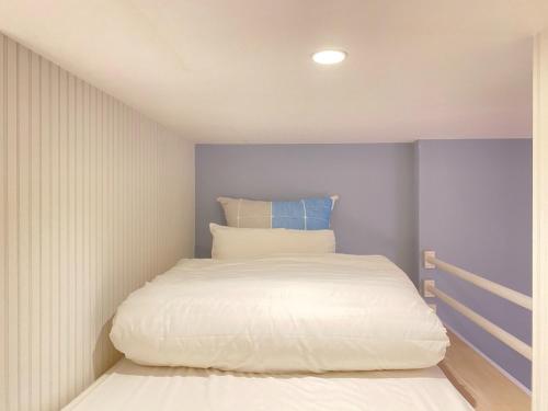 a small bedroom with a bed in the corner at K,K,House in Osaka - Vacation STAY 69352v in Osaka