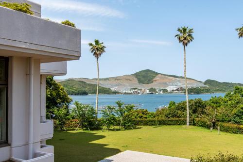 a view of the ocean from a house at Wisterian Life Club Toba in Toba