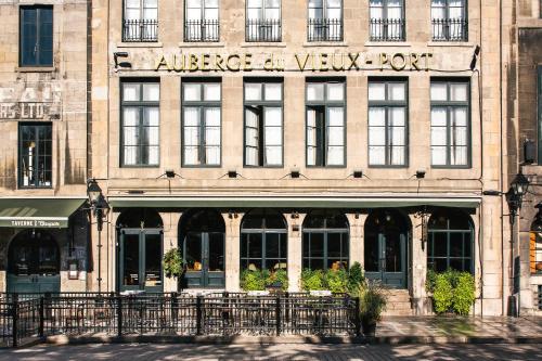 a large building with a clock on the front of it at Auberge du Vieux Port in Montreal