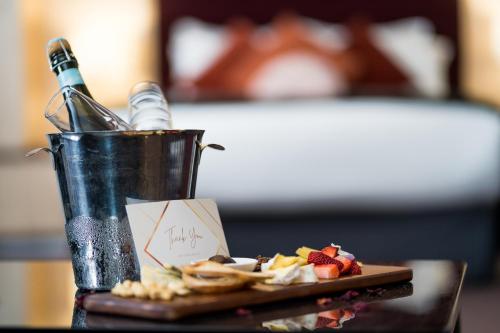 a plate of food on a table with a bucket of food at Mercure Albury in Albury