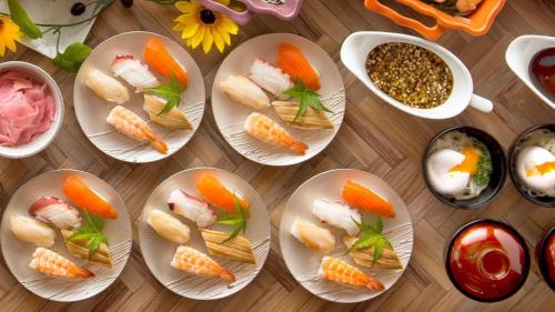 a group of plates of food on a table at Karatsu Seaside Hotel in Karatsu