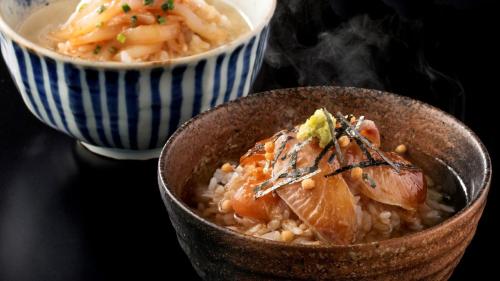 a bowl of food with meat on top of rice at Karatsu Seaside Hotel in Karatsu