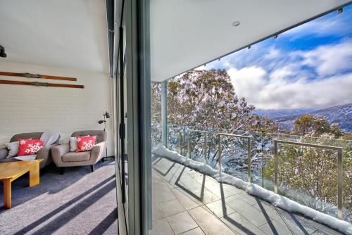 a balcony with a view of the mountains at Snow Ski Apartments 18 in Falls Creek