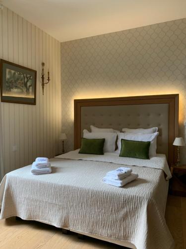 Ένα ή περισσότερα κρεβάτια σε δωμάτιο στο Au Fil du Temps