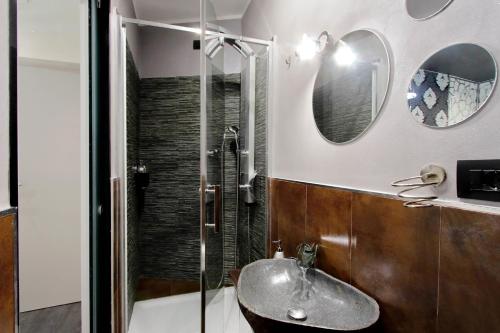 a bathroom with a sink and a shower at Suite Paradise Rome Guest Rooms in Rome