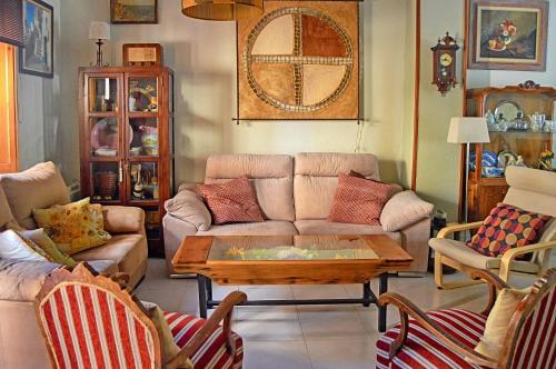 a living room with a couch and a coffee table at La Vieja Parra in La Puerta de Segura