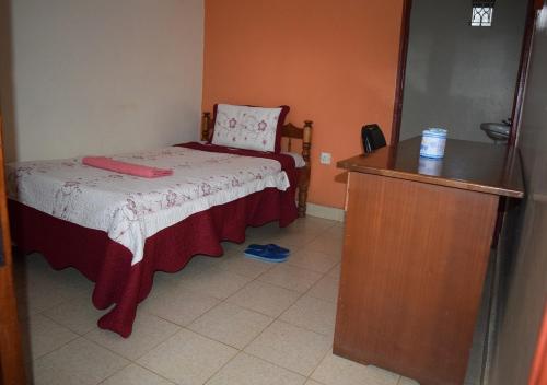 Postel nebo postele na pokoji v ubytování Mamba Village Kisumu