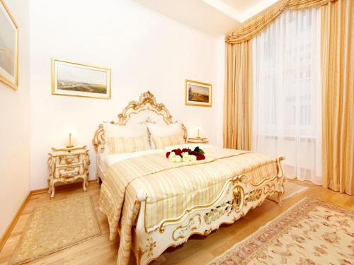 a bedroom with a large bed and a window at Kaiserin Sisi in Vienna
