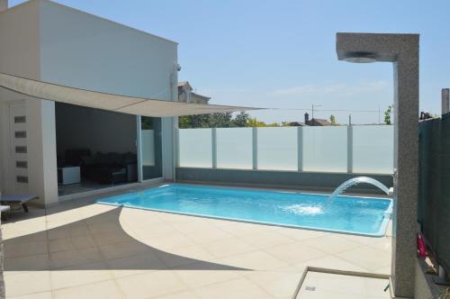 a swimming pool on the roof of a building at Lipa Mare in Solin