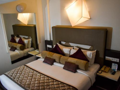 Postel nebo postele na pokoji v ubytování Nexstay Asma Tower