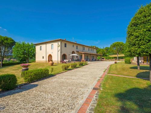 a stone driveway leading to a large building at Apartment Tegola by Interhome in Pogi