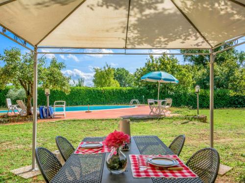 a table with a vase of flowers on top at Holiday Home Il Valacchio by Interhome in Valli