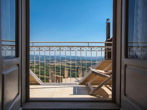 an open door to a balcony with a view at Apartment Agave by Interhome in Civitella Marittima