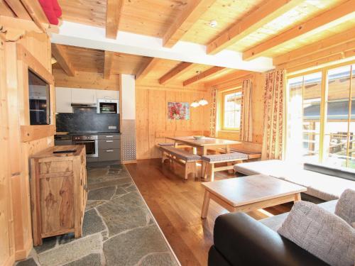a living room with a couch and a table at Chalet Chalet Alois by Interhome in Juns