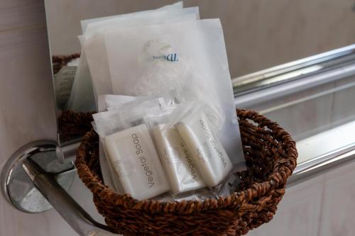 a basket filled with toothbrushes sitting next to a window at Il Complesso Saraceno in Torre delle Stelle