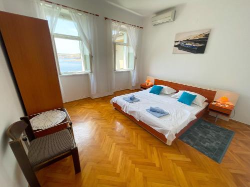 Posteľ alebo postele v izbe v ubytovaní Apartmani Perović