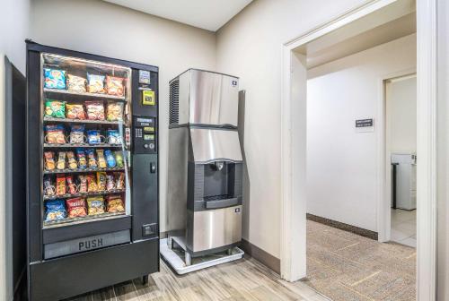 a refrigerator filled with food in a room at Sleep Inn & Suites At Kennesaw State University in Kennesaw