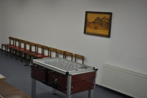 a row of benches with a ping pong table at Hotel Wagner in Obertauern
