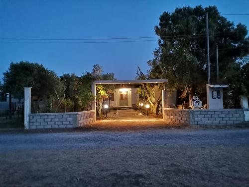 a front entrance to a house at night at Country House in Sozopoli