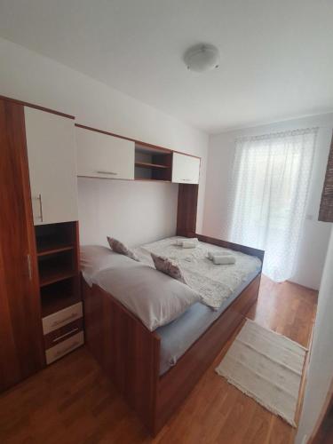 Postel nebo postele na pokoji v ubytování Apartment Kos
