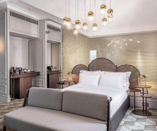 a bedroom with a large bed and a couch at The Stay Bosphorus in Istanbul