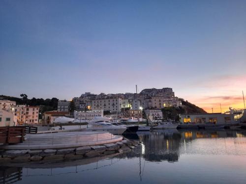 a group of boats docked in a marina at dusk at B&B La Maison del Borgo in Rodi Garganico