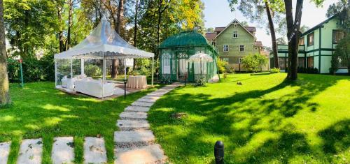 a gazebo in the yard of a house at Villa Joma in Jūrmala