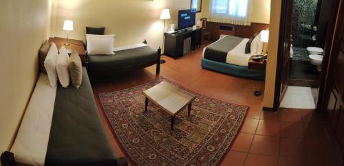 Postel nebo postele na pokoji v ubytování Corsaro Etna Hotel&SPA