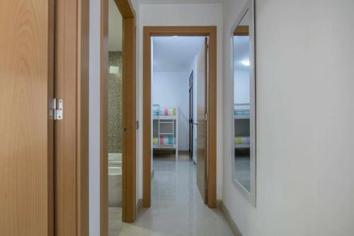 a hallway with two doors leading into a room at Apartamento centro histórico en Manresa in Manresa