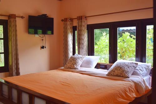 Een bed of bedden in een kamer bij Ya Teng Homestay