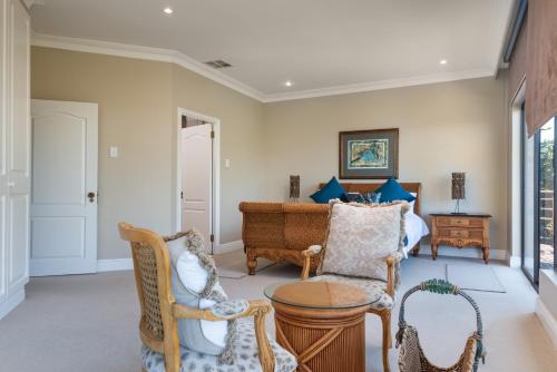 a living room with chairs and a couch at Ihlati 11 Zimbali Coastal Resort in Ballito