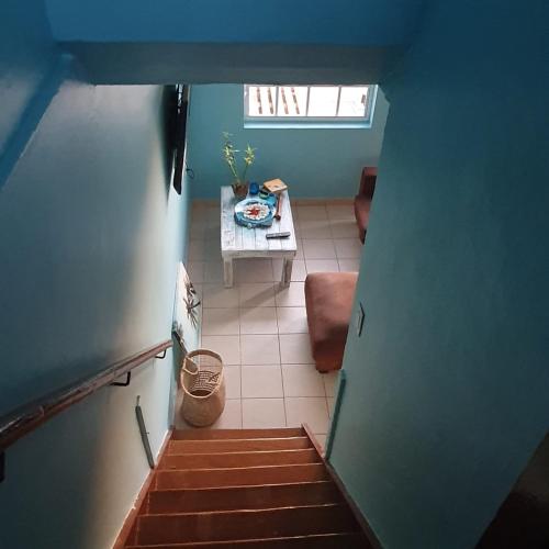 an overhead view of a kitchen with a table and a room at Blue Paradise Curaçao in Willemstad