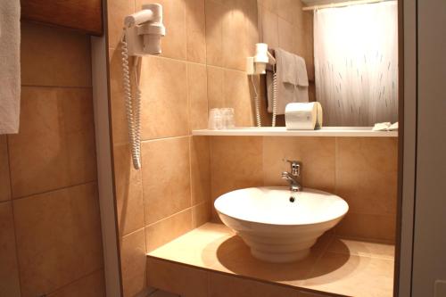 Koupelna v ubytování Hotel Zodiaque