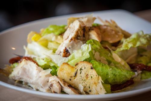 a salad on a white plate on a table at Pointe Isabelle in Chamonix-Mont-Blanc