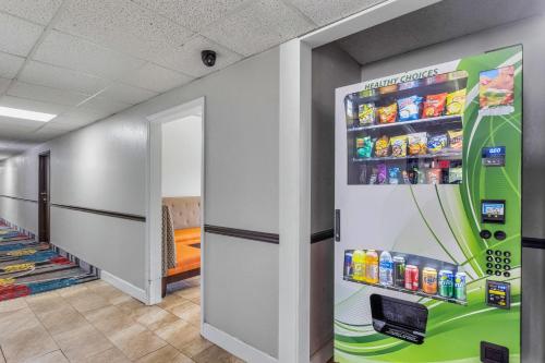 a hallway with a drink vending machine in a store at Days Inn by Wyndham Savannah Gateway I-95 in Savannah