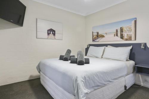 Ліжко або ліжка в номері Crown Apartments