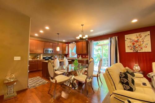 a kitchen and dining room with a table and chairs at B6-SERENE VILLA-Romantic get-away while WFH in Bothell