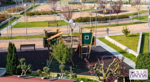 an aerial view of a park with benches and trees at Lillananna Reload in Porto SantʼElpidio